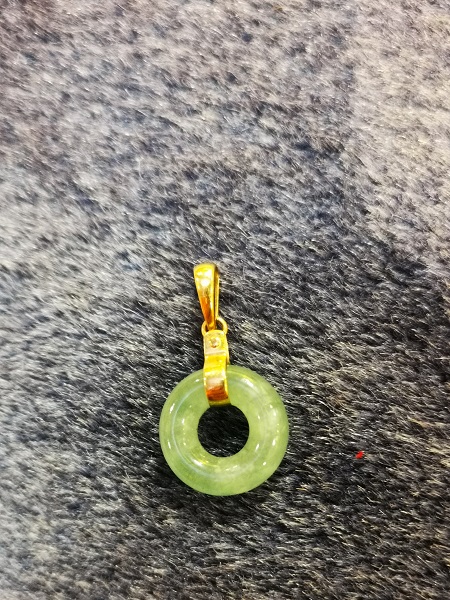 Small jade and gold pendant